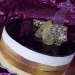 Croccante al cioccolato, pere caramellate al rosolio di arance e cereali con mousse al cioccolato profumato allo zenzero e crema soffice con ricotta di Giuseppe Giuliano